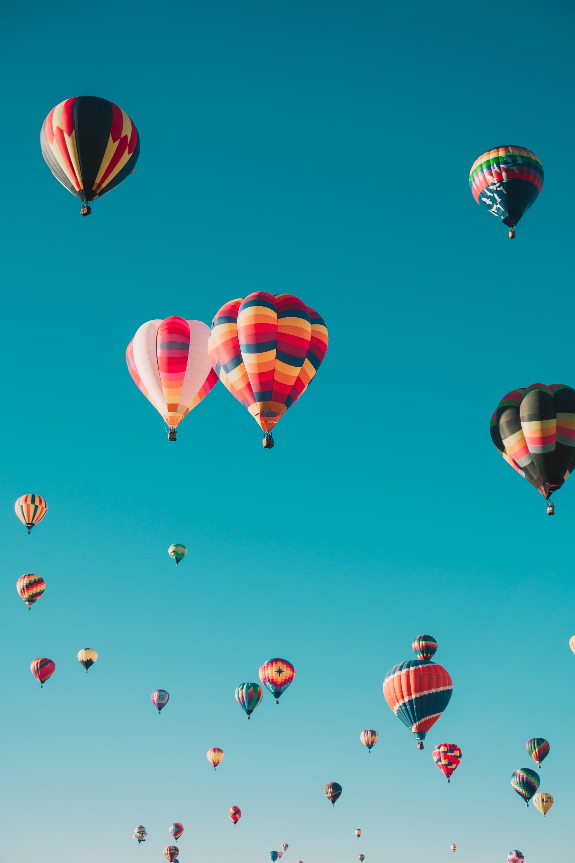 Colorful balloons in a turquoise sky